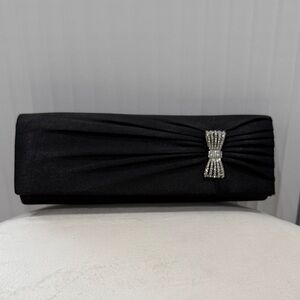 Sleek Black Clutch with Rhinestone Bow Accent